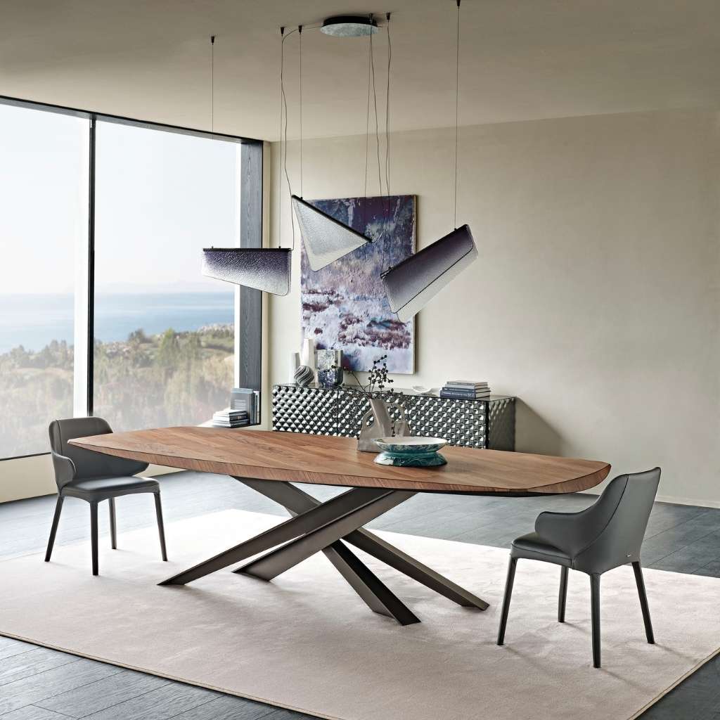 Chrome lacquered metal base dining table with modern style dining chairs with arms by Eforma