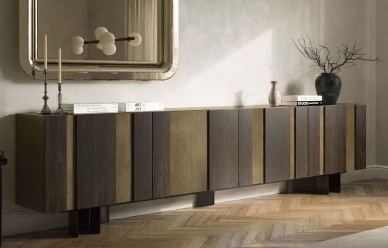 Closer view of a stylish dark oak brown wooden sideboard with modern decor on top.