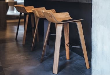 Modern oak wooden bar stools, adding a luxurious touch to any bar space.