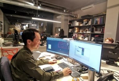 An interior designer working infront of the computer