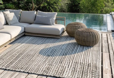 Weather resistant rug placed in a garden